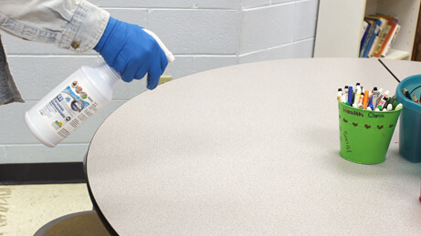 Peroxide Concentrate Spraying on Table