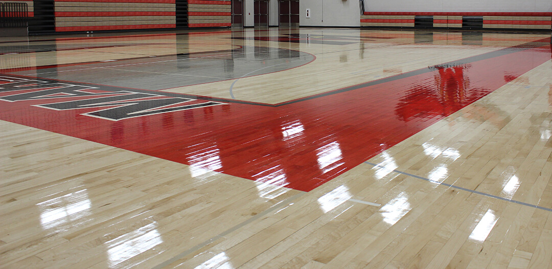 High Gloss Gym Floor with deep shine and reflection in red